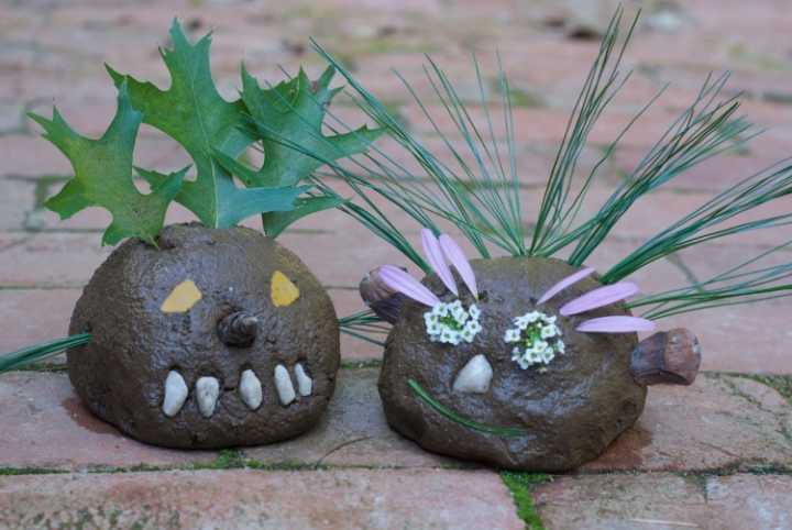 dirt balls decorated to look like people